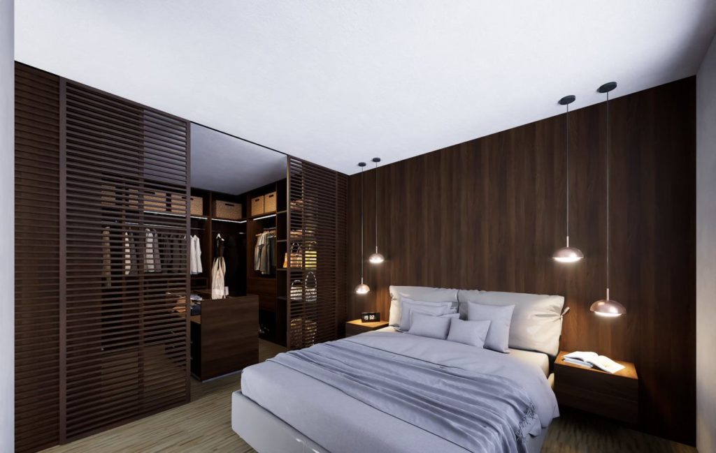 aménagements intérieurs d'une chambre parentale avec panneaux de bois et dressing room séparé par un claustra intérieur en bois